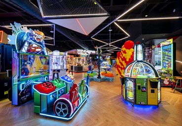 Why is an amusement arcade called an arcade?